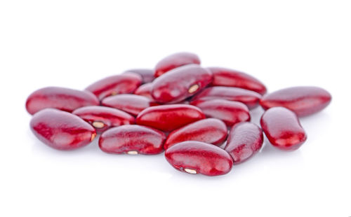 Close-up of cherries against white background