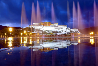 Illuminated buildings in city at night