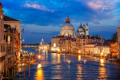 View of illuminated buildings at waterfront
