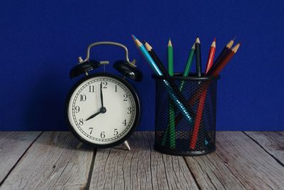 Directly above shot of clock on table