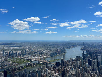 Aerial view of cityscape against sky