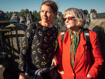 Women standing in front of old ruin