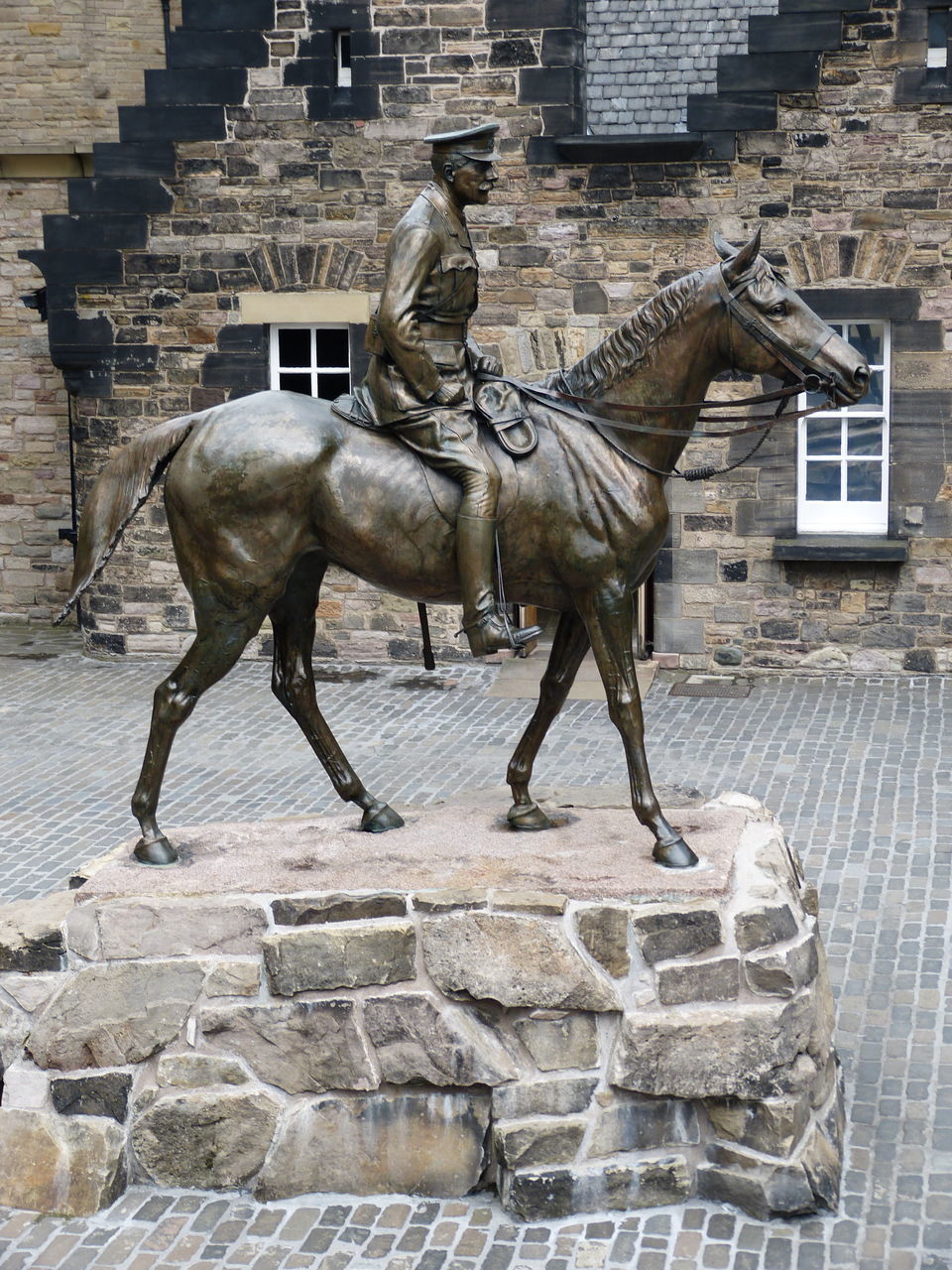 STATUE OF A HORSE IN BUILDING