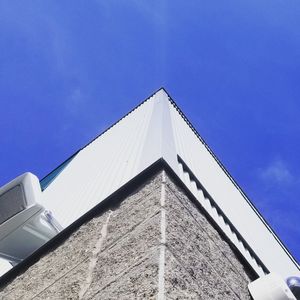 Low angle view of building against blue sky