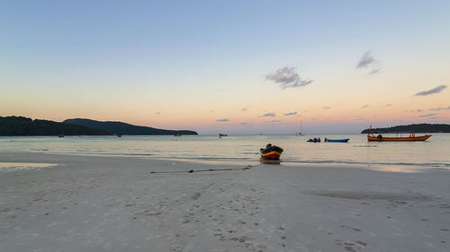 Scenic view of beach against sky during sunset