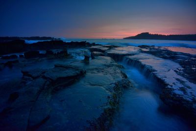 Scenic view of land during sunset