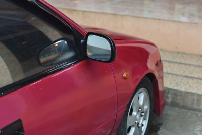 Close-up of car on road