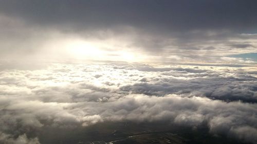 Aerial view of landscape against cloudy sky