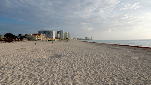 View of beach with city in background