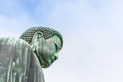 Low angle view of statue against sky