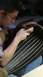 Low section of man using mobile phone