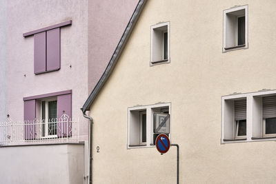 Low angle view of electric lamp on building