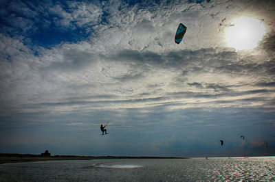 Low angle view of parachute against sky