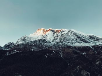 Scenic view of snowcapped mountain against sky