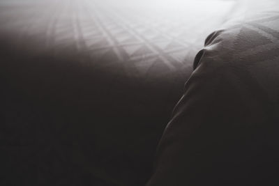 Close-up of hands against black background