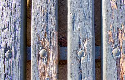 Full frame shot of wooden bench during sunny day