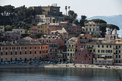 Buildings in town against sky