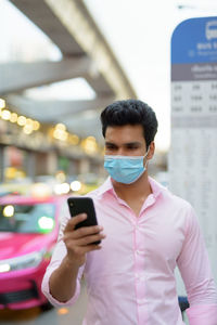 Young man using mobile phone