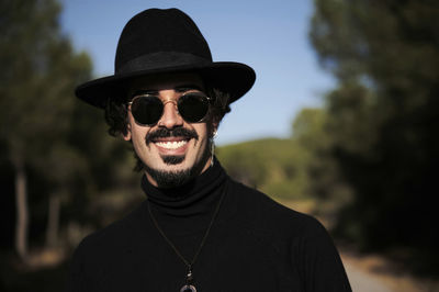 Portrait of young man wearing hat