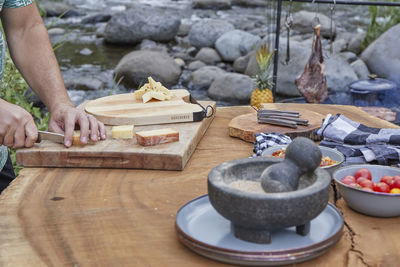 Charcuterie board being prepared at outdoor barbecue