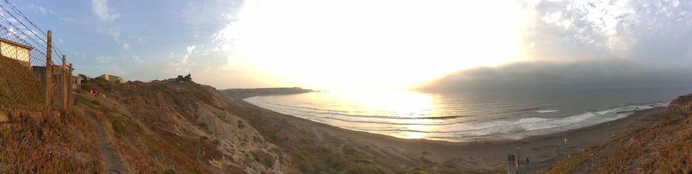 Panoramic view of sea against sky during sunset