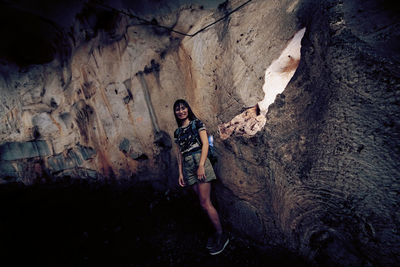 Woman standing on rock