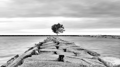 Scenic view of sea against cloudy sky