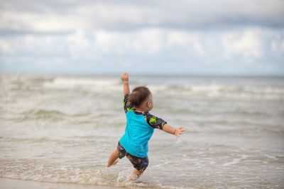 Full length of boy on beach