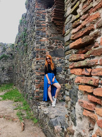 Woman with umbrella on wall