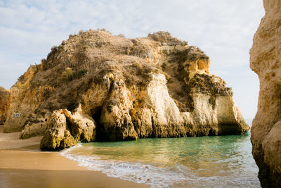 Rock formation on a sandy beach in portugal