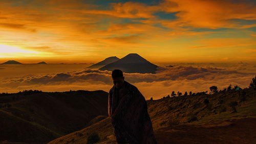 Scenic view of mountains against sky during sunset