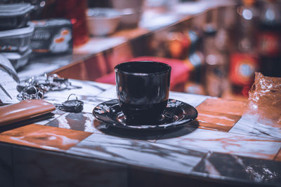 Close-up of coffee cup on table