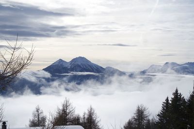 Scenic view of snowcapped mountains against sky
