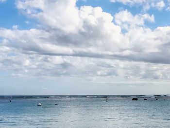 Scenic view of sea against cloudy sky