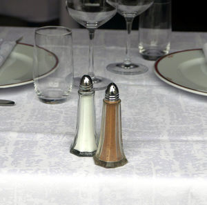 Close-up of salt and pepper shaker on table