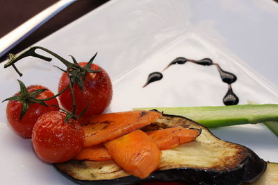 High angle view of fruits in plate on table