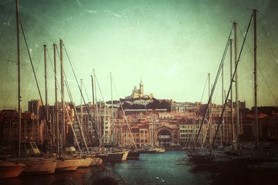 Boats moored at harbor