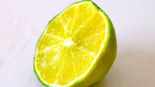 Close-up of lemon slice on table