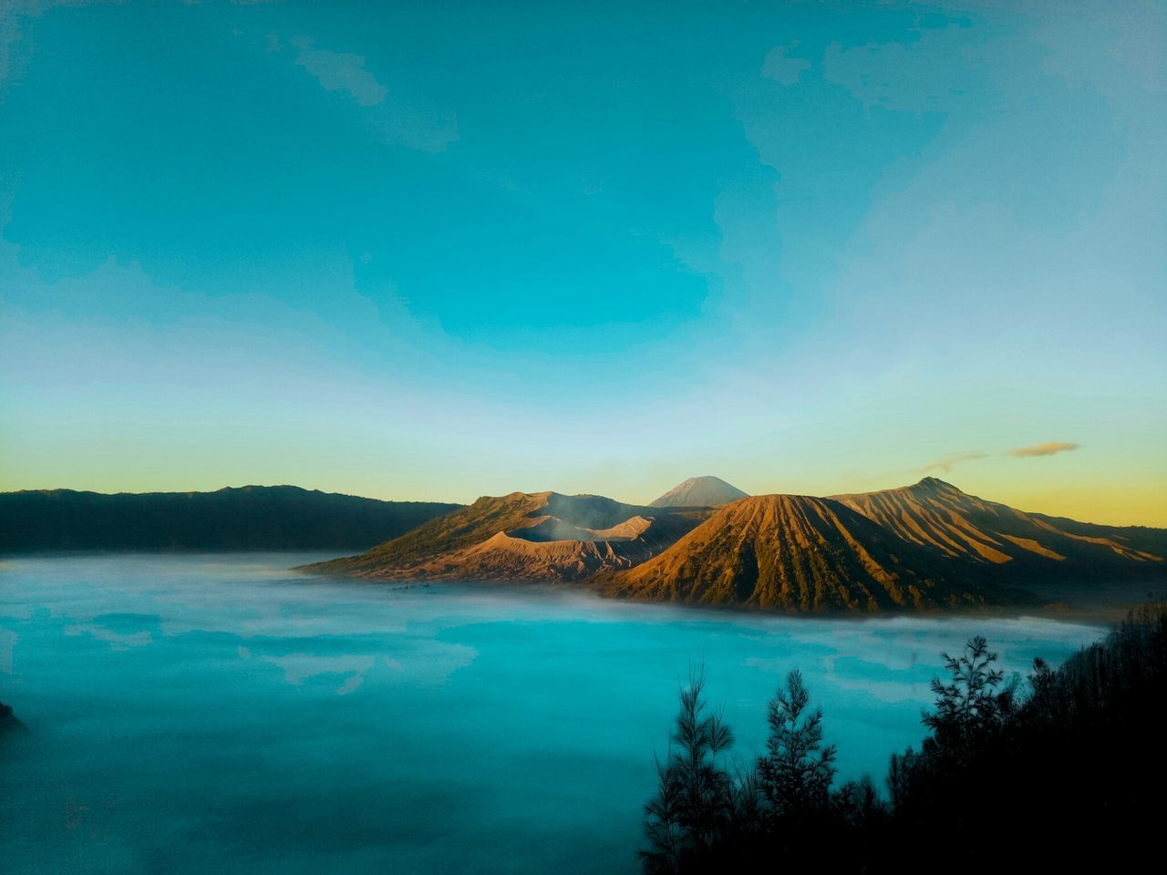 mountain, scenics - nature, sky, beauty in nature, water, dawn, volcano, nature, landscape, land, horizon, environment, tranquility, tranquil scene, tree, travel destinations, no people, reflection, cloud, morning, sunrise, blue, lake, non-urban scene, geology, plant, outdoors, travel, idyllic, volcanic crater, sunlight, volcanic landscape, tourism