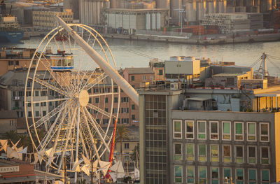 High angle view of buildings by river in city