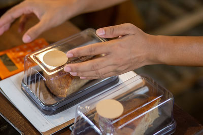 Cropped image of person preparing food