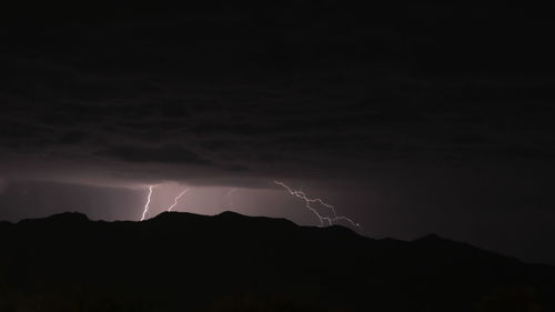 Scenic view of lightning in sky at night