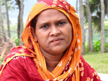 Portrait of young woman wearing scarf 