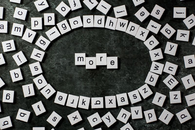 High angle view of toy blocks with text on table