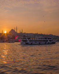 Scenic view of river against sky during sunset