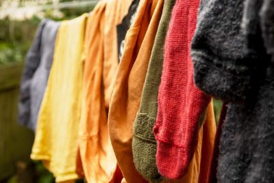 Close-up of socks drying on clothesline