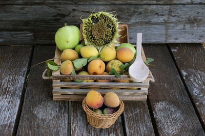 High angle view of fruits in basket on table