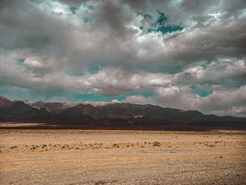 Scenic view of landscape and mountains against sky