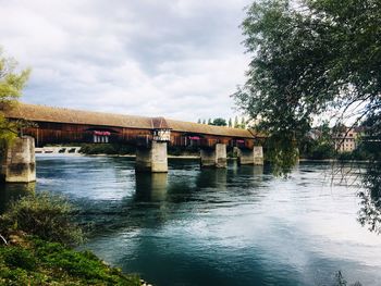 Bridge over river against sky