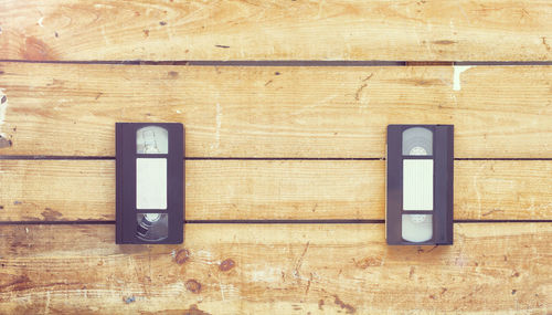 Directly above shot of audio cassettes on wooden table